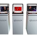 Transparent Display Shelf Showcasing Headphones With Screen Portraits And Swiss Price Information