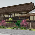 Traditional Guesthouse With Thatched Roof Wooden Structure Cherry Blossom Trees And Stone Wall