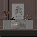 White Console Cabinet With Gold Handles And Decorative Items Against Pink Paneled Wall