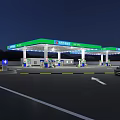 Petronas Gas Station At Night With Green Canopy Fuel Pumps And Parked Car