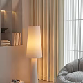 Tall White Floor Lamp With Soft Glow Near Beige Curtains And Gray Sofa