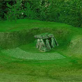 Natural Stone Structure in Circular Sunken Grassland with Trees and Pebble Ground