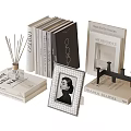 Elegant Book Collection With Decorative Books Scented Diffuser Photo Frame And Black Bookend