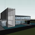 Modern Architectural Building Exterior With Glass Curtain Wall And Night Lighting At Entrance