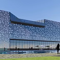Modern Sales Office Building Exterior Featuring Perforated Facade Large Glass Windows And Green Plants