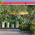 Outdoor Living Plant Wall Design With Red Awning Wooden Backdrop And Small Water Feature