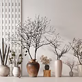 Brown and White Ceramic Vessels with Dried Flowers and Decorative Branches in Modern Home Decor