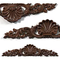 Artistic Dark Wood Carvings Showcasing Intricate Shell Shapes And Scrollwork Patterns