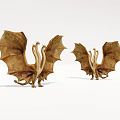Two Golden Winged Dragon Sculptures With Detailed Features And Artistic Design
