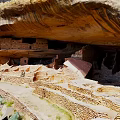 Ancient Cliff Dwellings Featuring Stone Structures Under Natural Rock Overhang 3d model