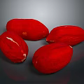 Four Ripe Red Fruits with Textured Surfaces on Dark Background