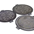 Urban Municipal Road Infrastructure Featuring Circular Patterned Metal Manhole Covers