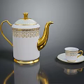 Elegant White Teapot With Gold Intricate Patterns And Matching Teacup Saucer Set