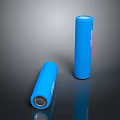 Blue Cylindrical Batteries In Standing And Lying Positions On Reflective Surface 3d model