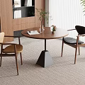 Modern Minimalist Dining Area With Round Wooden Table Two Chairs Vase And Potted Plant