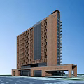 Modern Brown Office Building Featuring Glass Curtain Wall Numerous Windows And Base Entrance