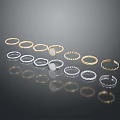 Assorted Fashion Rings Collection With Gold Silver Bands And Shiny Reflection