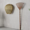 Natural Woven Basket and Bamboo Rake Tool as Indoor Wall Decor for Home Living