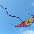 Colorful Decorative Kite With Purple Pink Yellow Fan Shaped Pattern On Light Blue Background