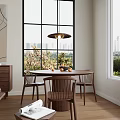 Round Dining Table Set With Three Wooden Chairs By Large Window And Hanging Pendant Light