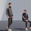Two Men In Black Striped Outfits Standing And Sitting With Light Shoes On Dark Floor