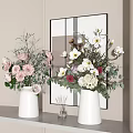 White Vases With Fresh Flowers And Green Foliage On Modern Shelf By Wall Mirror