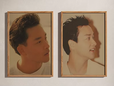 Two Wooden Framed Portrait Paintings with Profile Views and Different Expressions on Wall 3d model