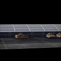 Two Sand Colored Military Tanks With Tracks Parked In Industrial Warehouse