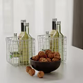 Wire Baskets With Bottles And Bowl Of Walnuts On Kitchen Counter