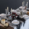 Elegant White Dinnerware Set with Plates Bowls Glasses Candle Holders Decorative Balls on Dining Table