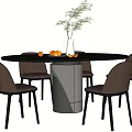 Round Black Dining Table Set With Brown Chairs Metal Base And Green Plant