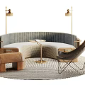Curved Public Seating with Brass Lamps Small Round Table Brown Ottoman and Rug