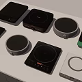 Multiple Modern Induction Cookers Displayed On Kitchen Table With Various Designs 3d model