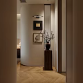 Modern Entryway Interior Design With Curved Wall Framed Artworks Wall Lighting And Wooden Pedestal