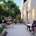 Modern Urban Plaza Landscape With Contemporary Building Lush Greenery And Stone Pathways