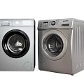 Silver Front Load Washing Machines With Control Panels And Transparent Doors