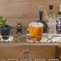 Stylish Bar Cart Setup With Ice Bucket Bottles Plant And Glassware