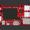 Red Computer Circuit Board With Black Heat Sink Components and USB Ports