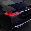Black Luxury Sedan Parked On Gray Concrete Ground With Sunset Sky Background