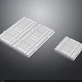 White Rectangular Electronic Components With Grid Pattern And Different Sizes