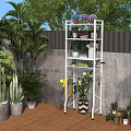 White Multi Tiered Plant Stand With Potted Flowers And Greenery In Outdoor Garden