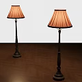 Two Floor Lamps with Red Lampshades and Dark Metal Poles on Herringbone Wooden Floor