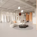 Modern Minimalist Clothing Store Interior With Curved Sofa Golden Partitions Clothing Racks And Pendant Lights