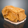 Natural Wood Stone With Yellowish Brown Color And Rough Natural Texture Displayed On White Base