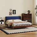 Double Bed With Blue Headboard Wooden Nightstand Patterned Quilt And Framed Pictures On Wooden Floor