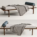 Modern Ottoman With Upholstered Cushion Wooden Legs Gray Fringed Blanket And Blue Roller Pillow