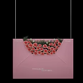 Decorative Pink Envelope Adorned With Red White Roses And Green Leaves