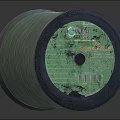 Green Thread Spool With Wound String And Label On Dark Surface 3d model