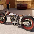 Unique Custom Motorcycle With Red Wheels Exposed Engine And Brown Leather Seat In Brick Garage