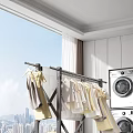 Modern Clothes Rack With Hanging Clothes In Bright Laundry Room Near Washing Machine